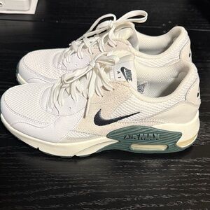 Nike Women's White and Cream Sneakers with Green Accents